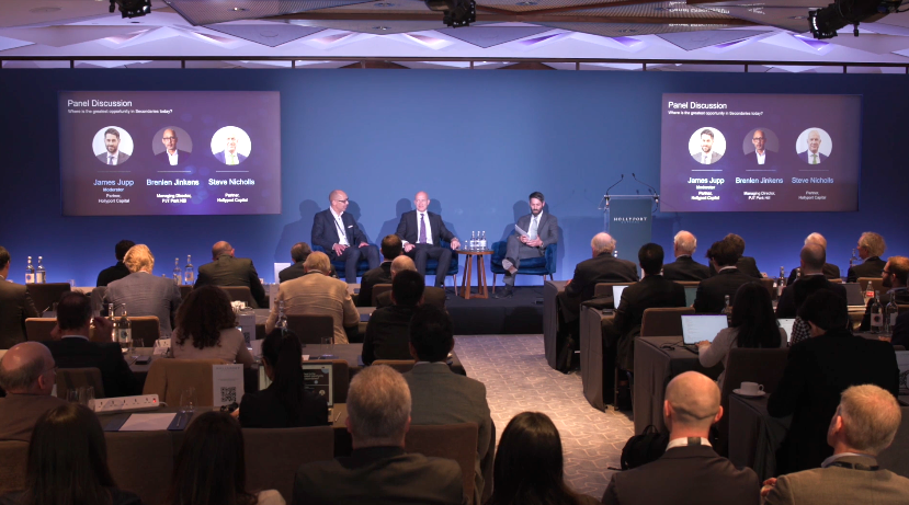Hollyport Capital investor day: panel discussion on stage with screens either side